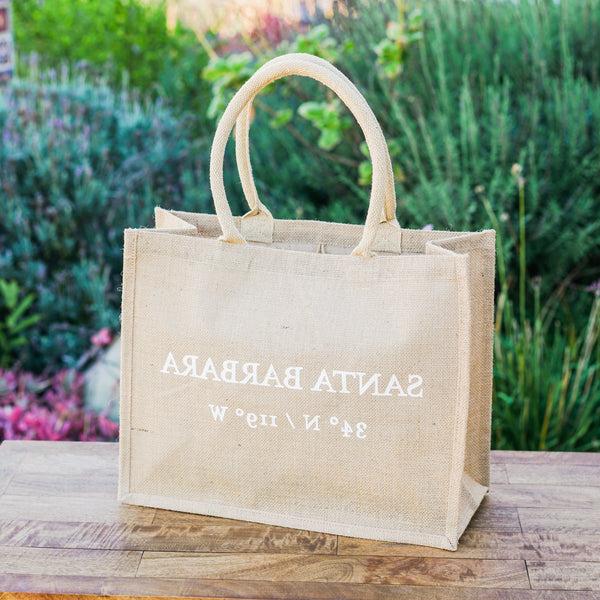 Santa Barbara Coordinates Tote Bag displayed outdoors
